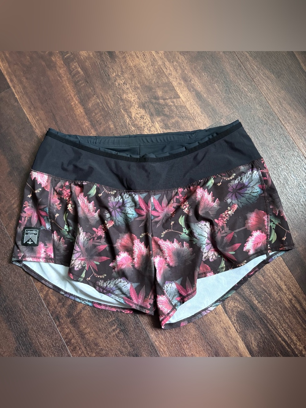 Sold Oiselle Women's Floral Black Running Shorts with back zip pocket size 8